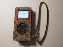 Black 8Gb iPod Nano with a Coach Signature Stripe Case